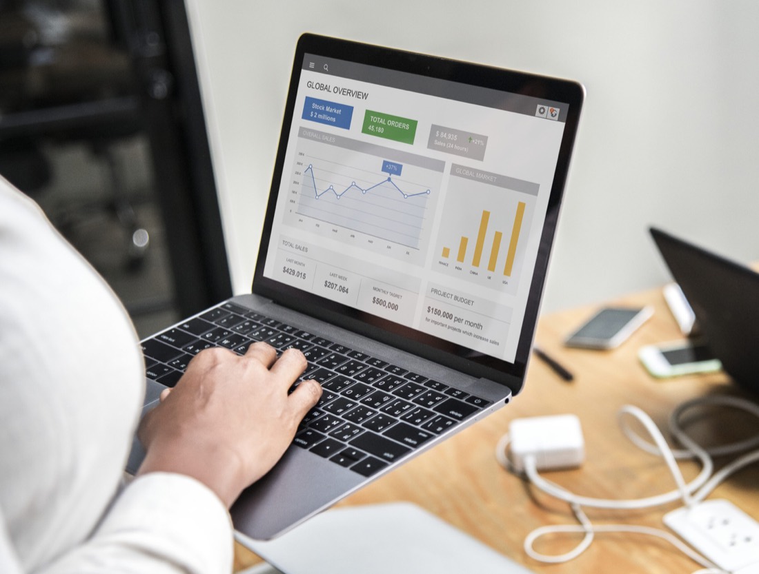 A laptop showing a search results page with paid and organic listings